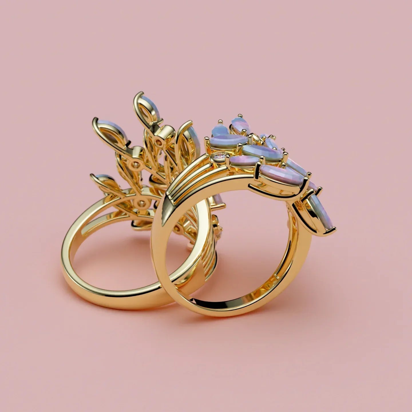 Guldforlovelsesring med opalsten og elegante bladmotiver på lyserød baggrund