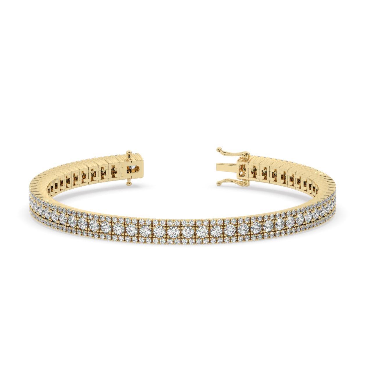 TENNISARMBÅND I 18 KT GULGULD MED 5,50 CT. HVIDE BRILLANTER
