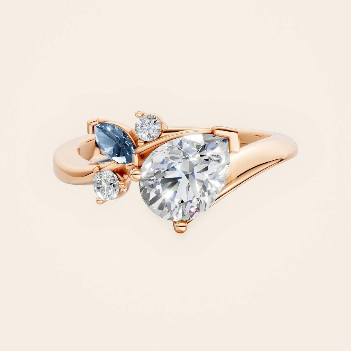 DR0332 diamantring med pæreformet diamant og blå markise i 14 kt. rosaguld, forfra