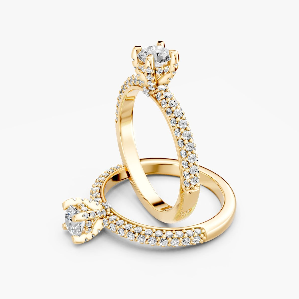 To ZRT04 solitaire diamantringe i 14 kt. gulguld med pavé-skinne