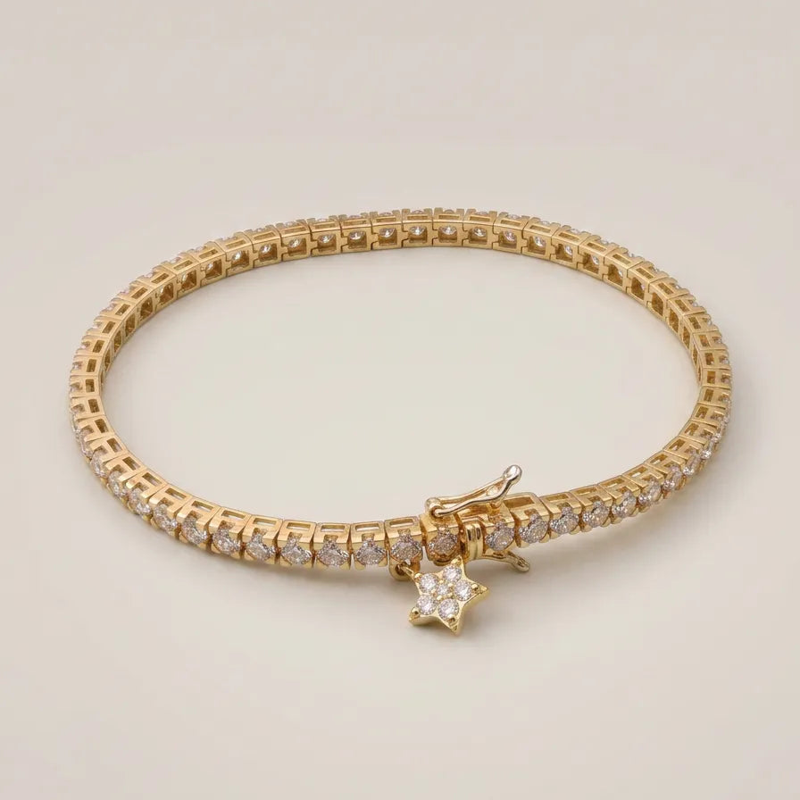Tennisarmbånd i 18 kt gulguld med 3.10 ct naturlige brillantslebne diamanter i kvaliteten F-G VS-SI og aftageligt stjernevedhæng fra MANICH