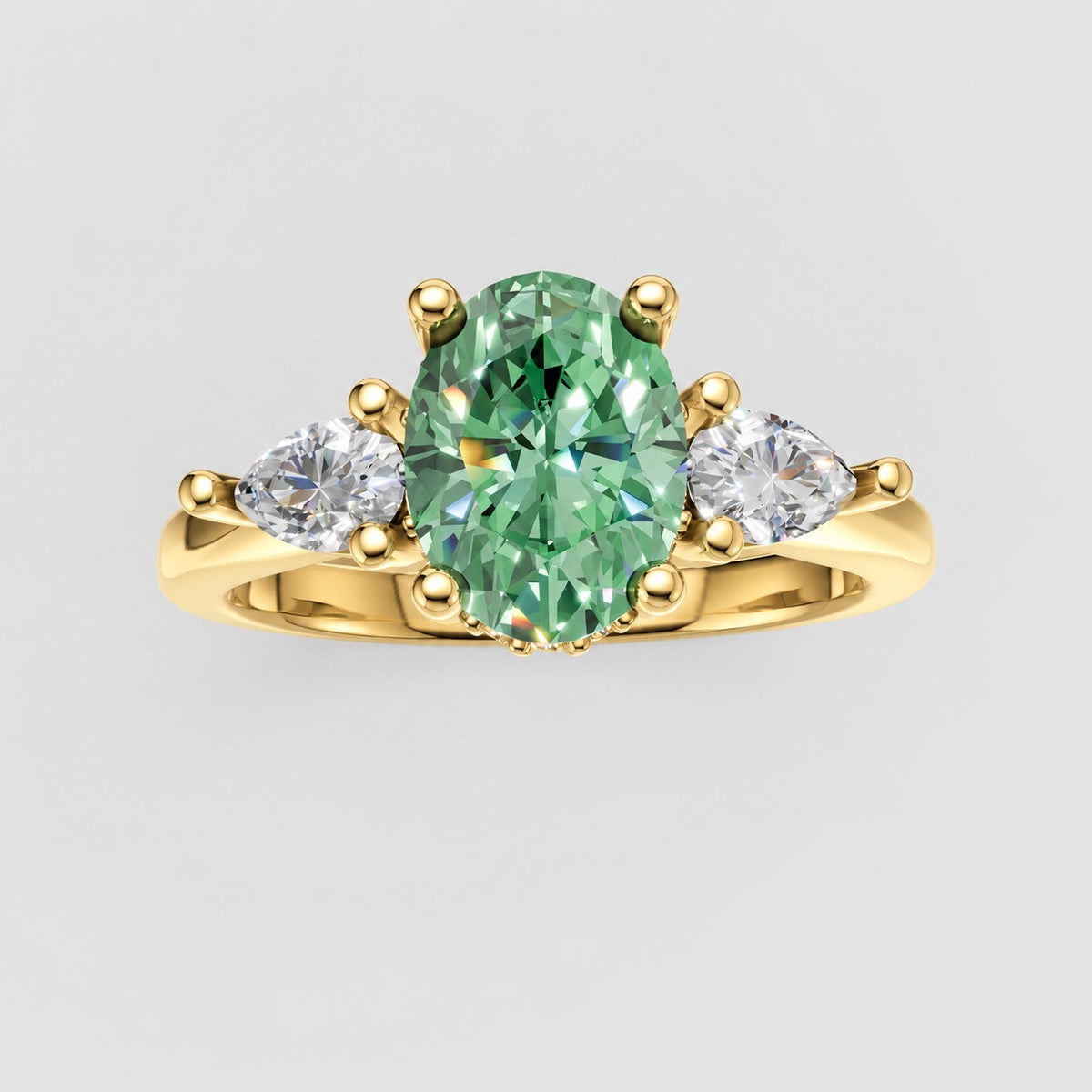 ZRT037 diamantring med grøn oval lab-grown diamant og to dråbeformede diamanter i 14 kt. gulguld, set ovenfra