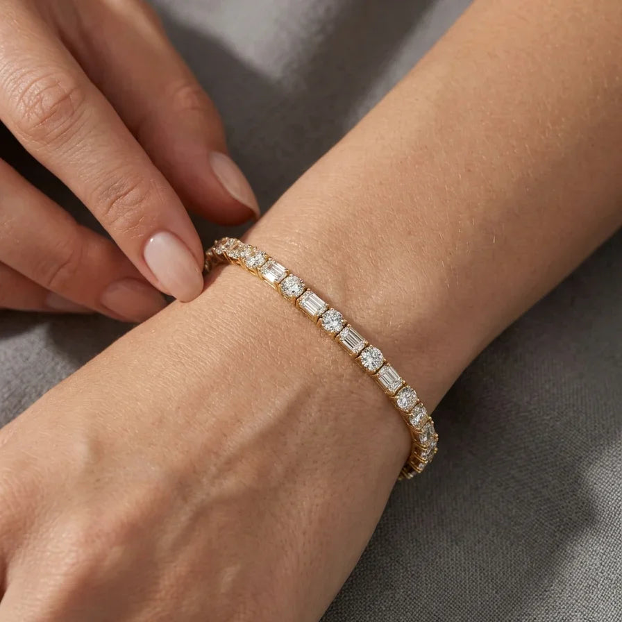 Woman wearing lab grown diamond tennis bracelet yellow gold 7 inch wrist