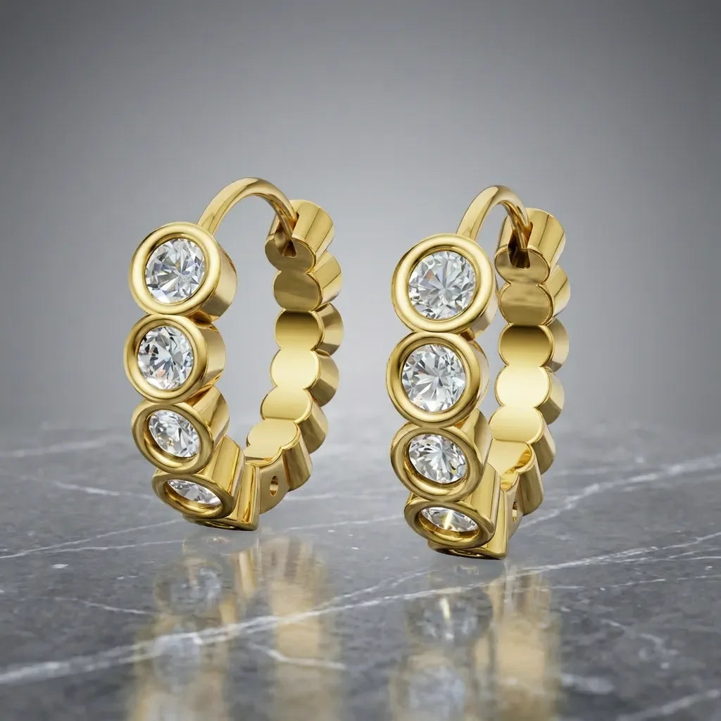 Eksklusive diamant creoler i 14 kt gulguld med bezel-fatning og 1.01 ct diamanter
