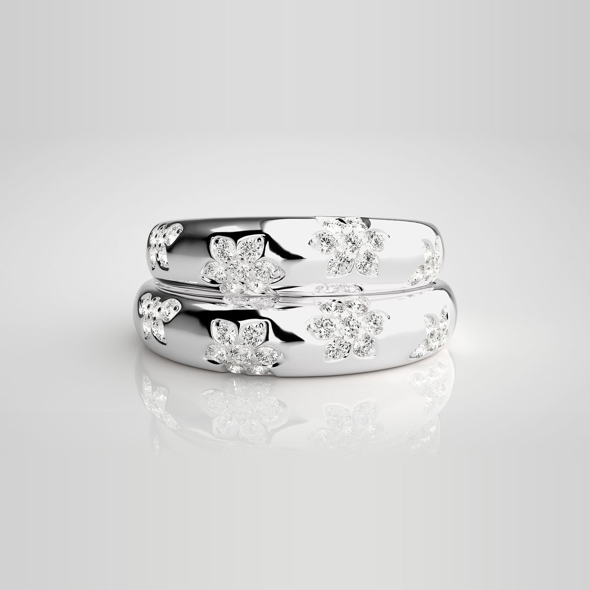 HJ41956 vielsesringe med diamantblomster i 14 kt hvidguld – stablet, set forfra