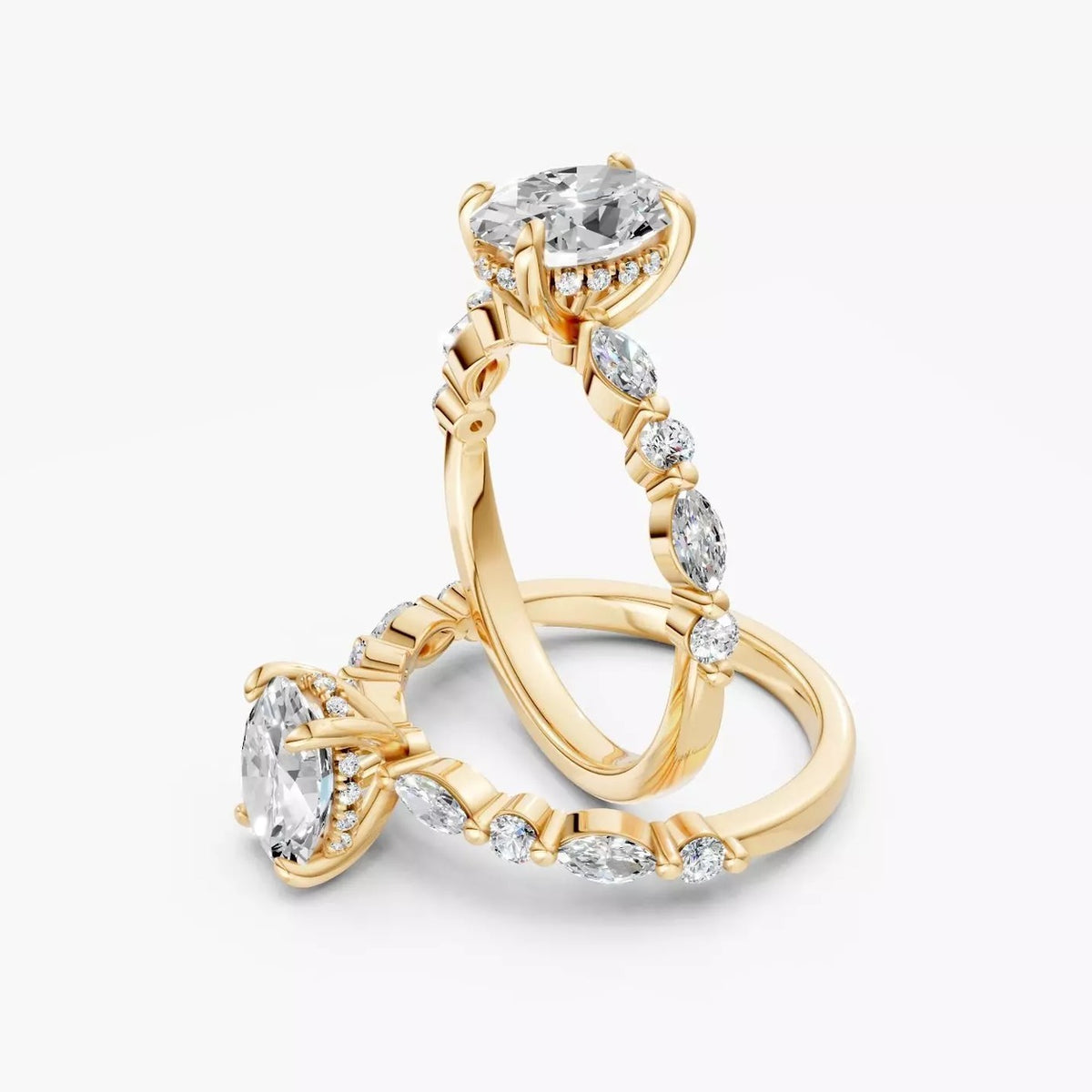 To ZAB004 diamantringe med oval diamant i 14 kt. gulguld