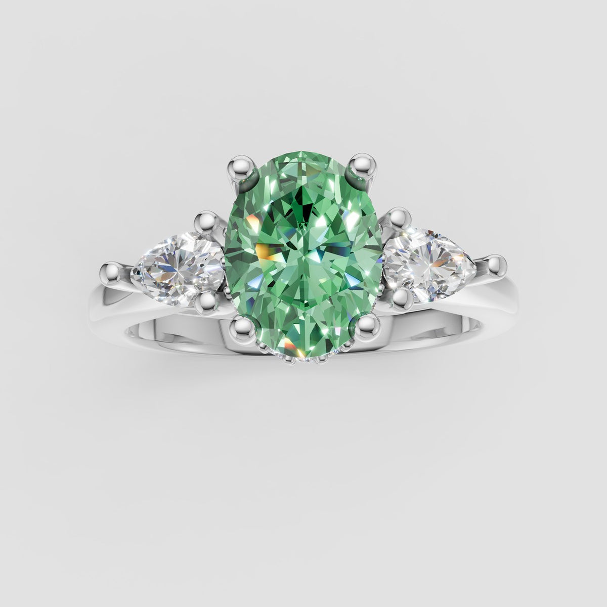 ZRT037 diamantring med grøn oval lab-grown diamant og to dråbeformede diamanter i 14 kt. hvidguld, set ovenfra