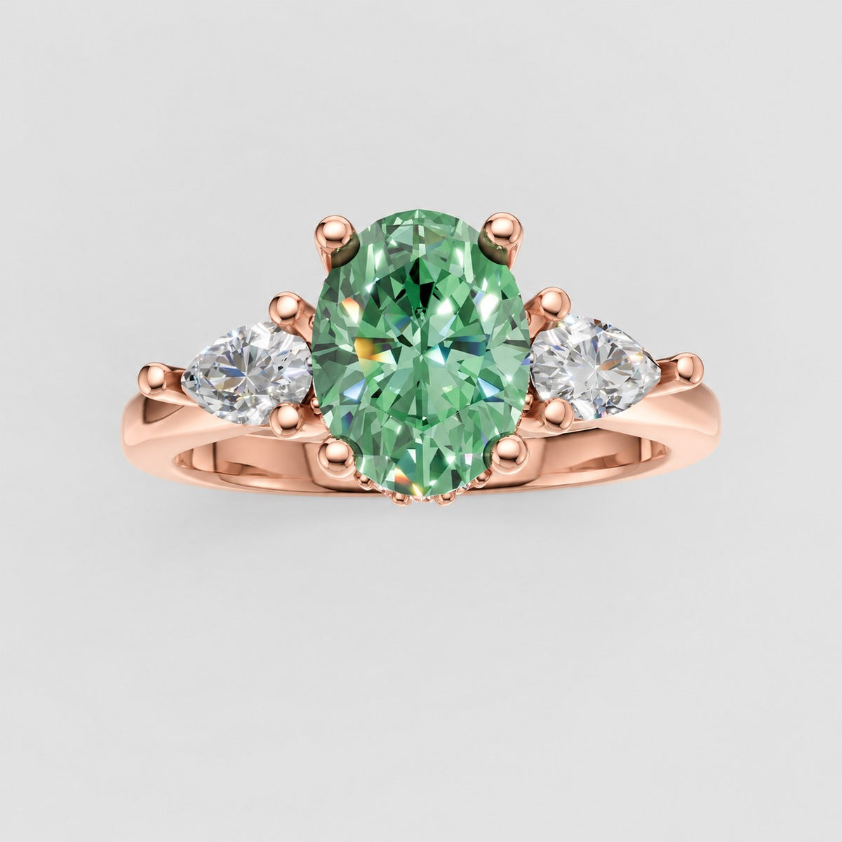 ZRT037 diamantring med grøn oval lab-grown diamant og to dråbeformede diamanter i 14 kt. rosaguld, set ovenfra